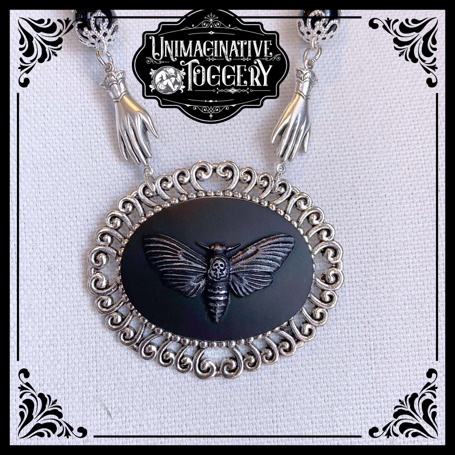 Black and silver beaded necklace deaths head moth cameo pendant hands - Unimaginative By Charli Siebert