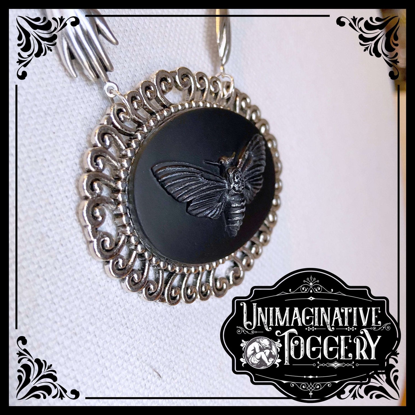 Black and silver beaded necklace deaths head moth cameo pendant hands - Unimaginative By Charli Siebert